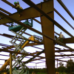 Red steel framing under construction