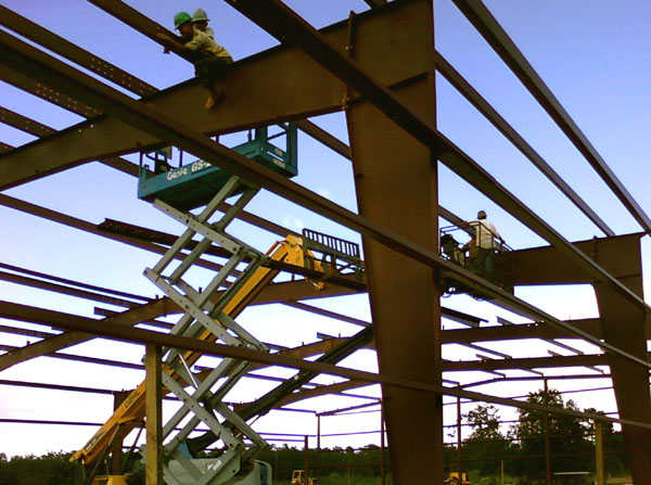 Red steel framing under construction