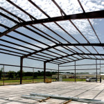 Red iron framing of steel building under construction