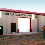 Steel agricultural workshop with red roofing