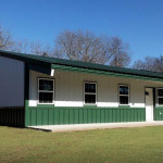 White and green steel hunting cabin