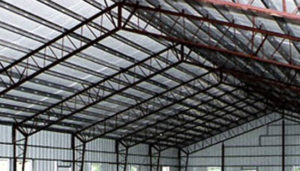 Photo of web truss style steel building.