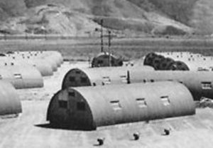 Photo of Quonset huts on a military base.