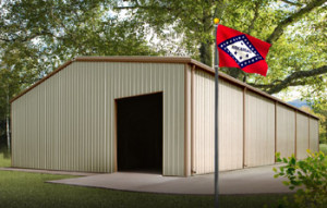 A large tan and brown metal building in a rural Arkansas setting