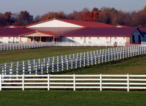 Photo of an enormous steel building stables in Texas.