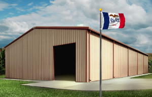 A tan and brown metal building against a bright summer sky in Iowa