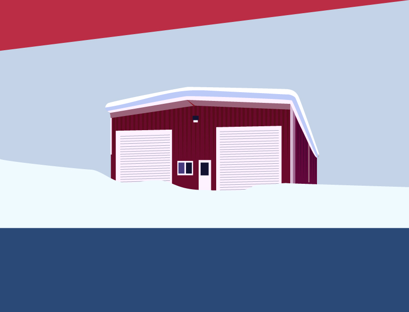 Steel building in a field of snow