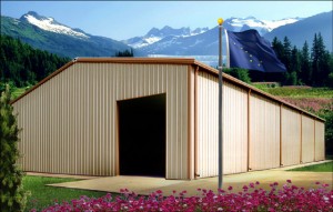 Metal building pictures before snow capped mountains in Alaska