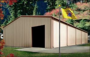 tan and brown industrial metal building in autumn woodlands with New Jersey flag flying in the foreground