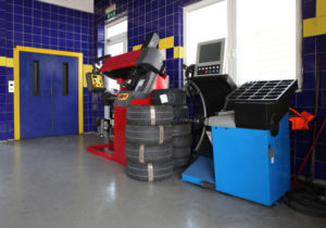 Photo of the interior of a modern car repair shop.