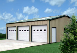 Photo of a green and tan 3-car metal garage.