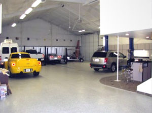 Photo of an interior of a multi-vehicle steel garage.
