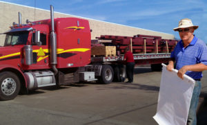 Photo of a RHINO  metal building kit arriving by truck.