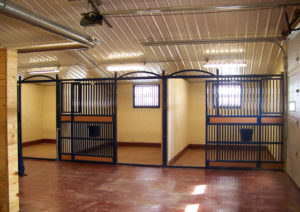 Photo of the interior of a RHINO steel stables.