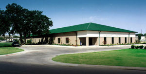 Photo of a RHINO commercial building with a green hip roof.