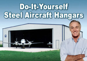 smiling private pilot stands in front of his steel aircraft hangar and plane